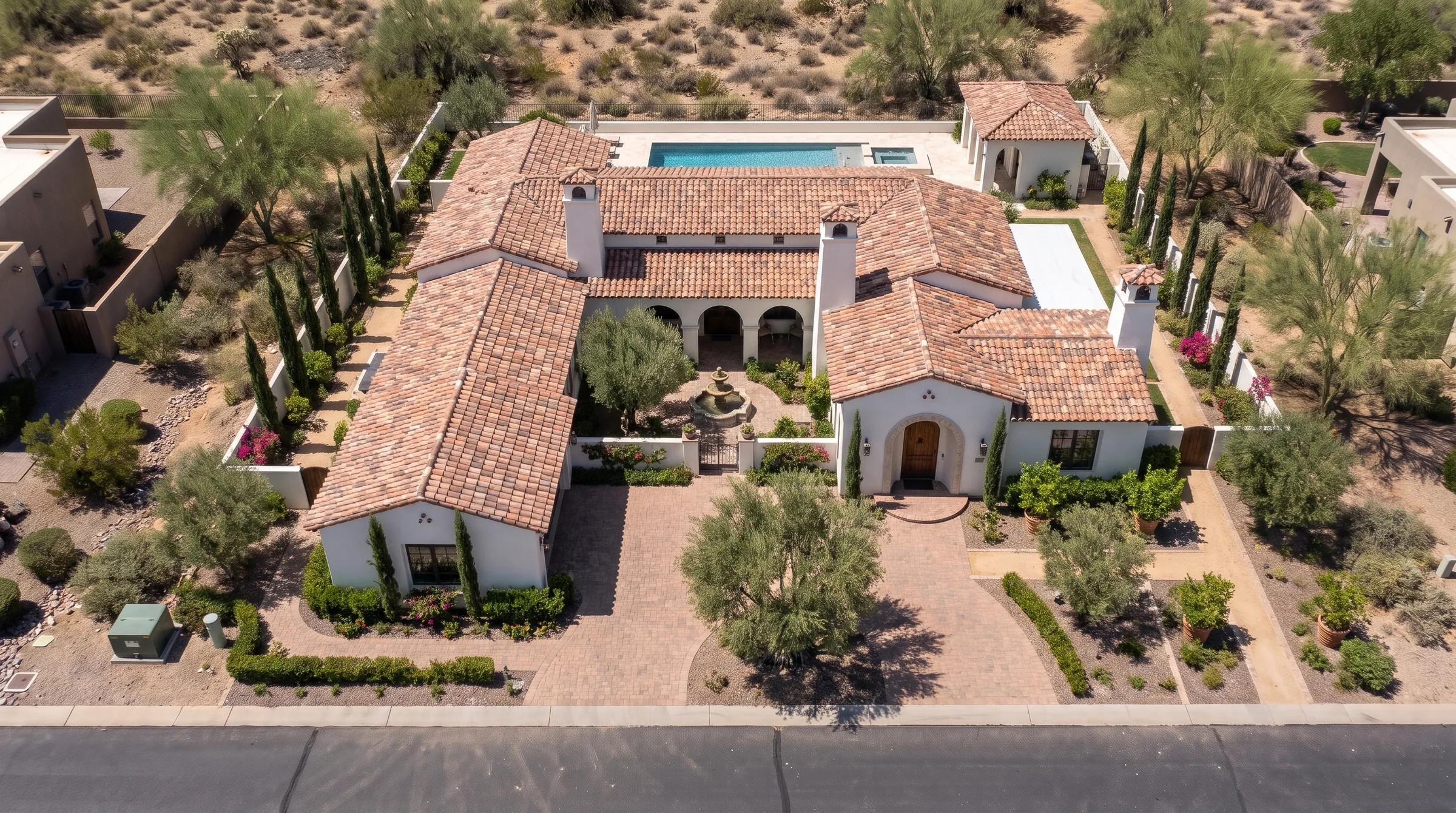 The same lot with a finished Spanish Colonial estate home, courtyard and pool